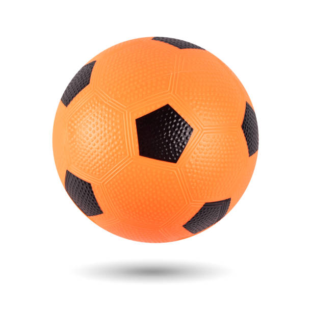 Orange Rubber Ball with Black Spots Isolated over White Background