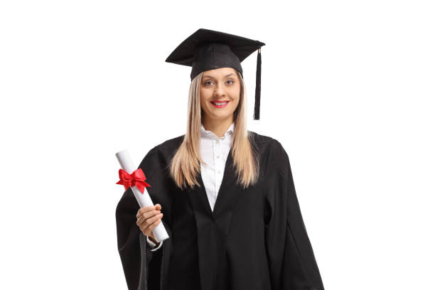 istock Female graduate student with a diploma wearing a graduation hat 1152360557
