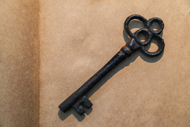 old key on vintage paper background