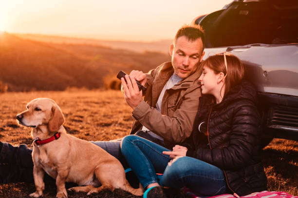 istock Father teaching daughter how to use binoculars at camping 1152364649