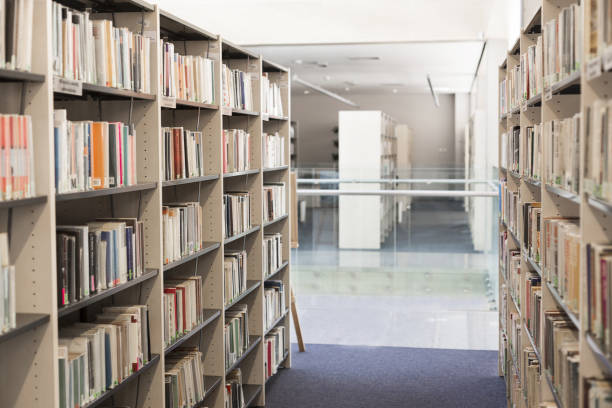 istock Books arranged in shelves at university library 1152366115