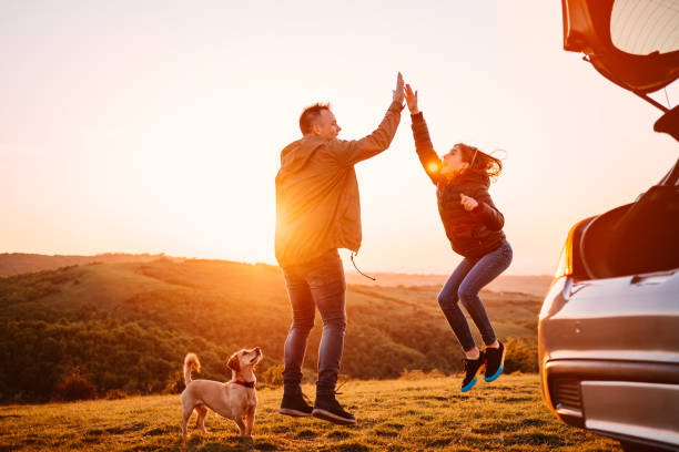 istock Father and daughter giving high five while jumping during camping 1152366375