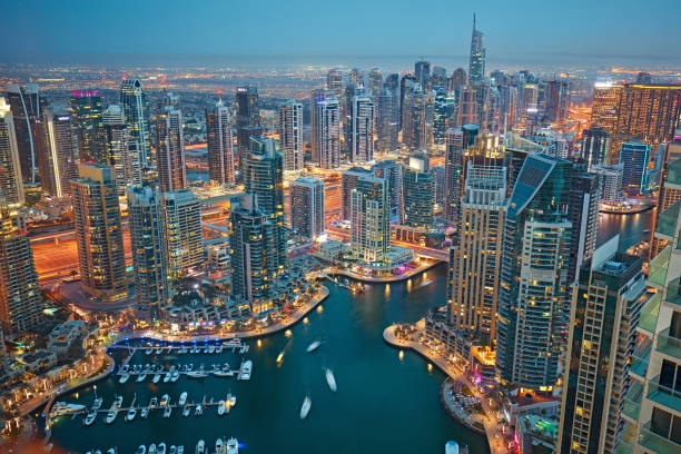 Aerial view of Dubai marina at dusk Aerial view of Dubai marina at dusk. dubai marina panorama stock pictures, royalty-free photos & images