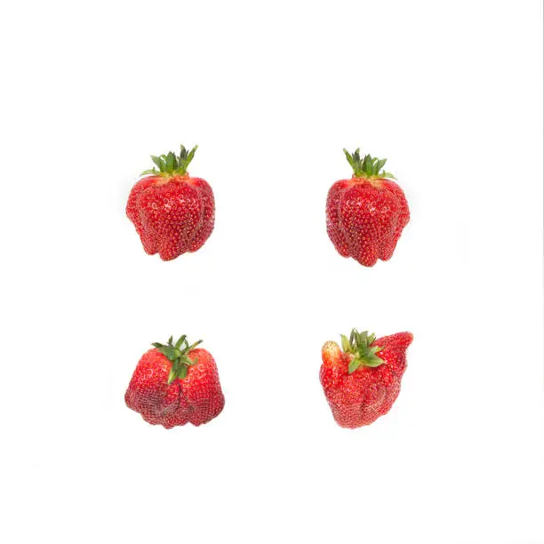 Photo of Strawberries isolated on white.Ugliness.