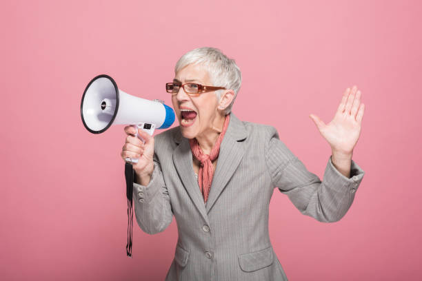 istock Woman shouting through megaphone 1152370706