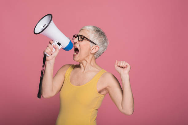 istock Woman shouting through megaphone 1152372366
