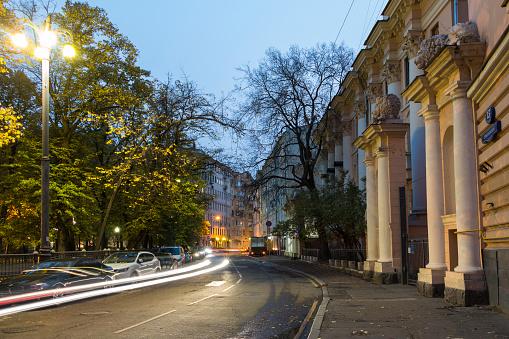 Russia, Moscow, October 10, 2017: Patriarchal ponds at dusk, traces of headlights