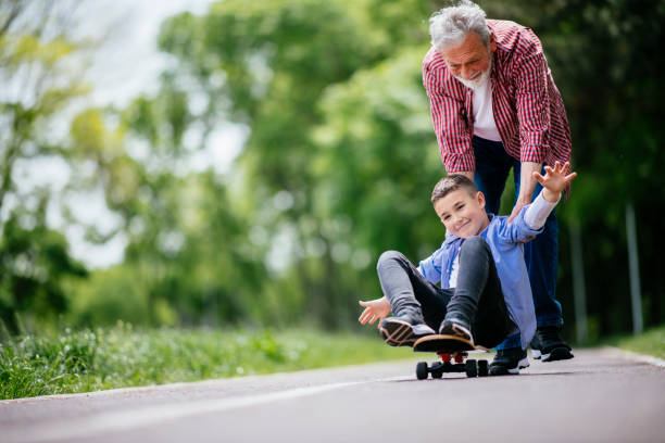istock Little boy trying skateboard 1152372605