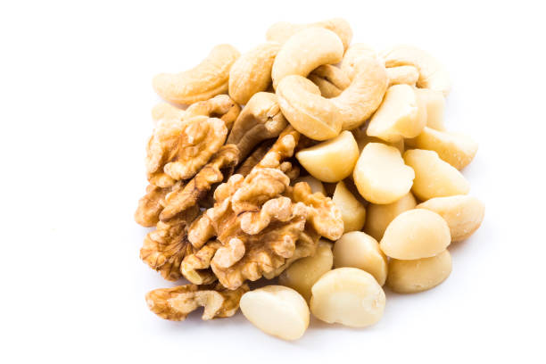 istock Variety of fresh nut on white background 1152373085