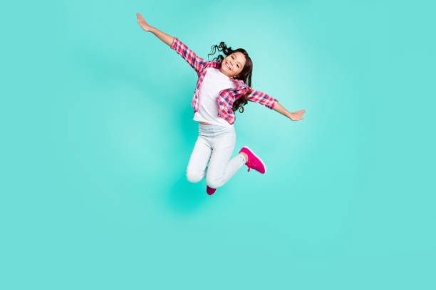 full length body size view photo of sweet funky charming kid have travel trip vacation raise hands satisfied content glad rejoice wear checked shirts sneakers trousers isolated green background - carefree joy children only pre adolescent child imagens e fotografias de stock