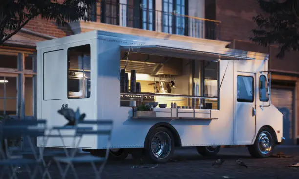 White realistic food truck with detailed interior on street. Modern cityscape. Takeaway food and drinks. 3d rendering.