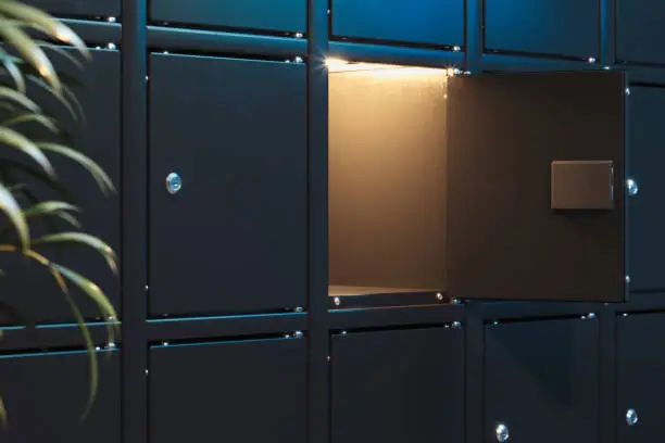Black safe deposit boxes with switched-on light. Safety closets. 3d rendering. one safe deposit box is opened
