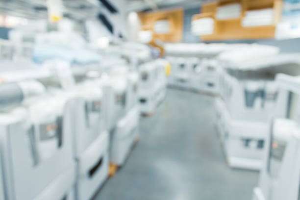 istock Blurred bix box store supercenter with customers shopping for home goods. 1152380365