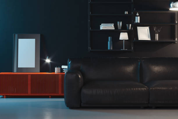 istock Blank transparent photo frame with blank poster near black couch, 3d rendering 1152380439