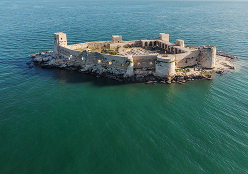 Kızkalesi is a town in Mersin Province, Turkey. he town, known in Antiquity as Corycus or Korykos, is named after the ancient castle built on a small island just facing the town.