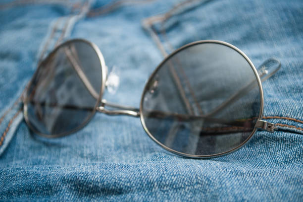 istock sun glasses on blue jeans background 1152382461