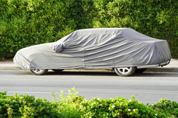 istock A parked car with protective cover in sun weather 1152385830
