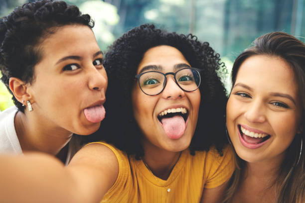 istock Good friends spending time together and having fun, taking selfies 1152386304