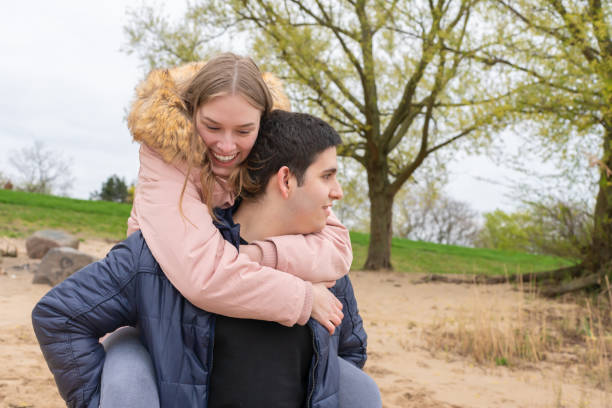 istock A couple has fun on the beach and he wears them huckepack 1152387327
