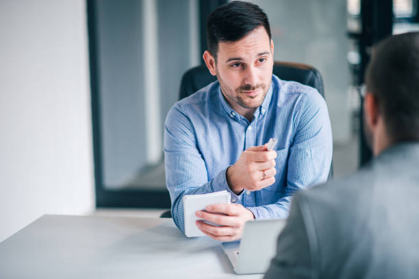 istock Handsome businessman conducting job interview. 1152387516
