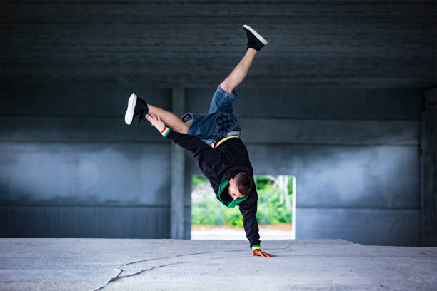 istock Young Adult Man Breakdancing in Industrial Hall 1152387533
