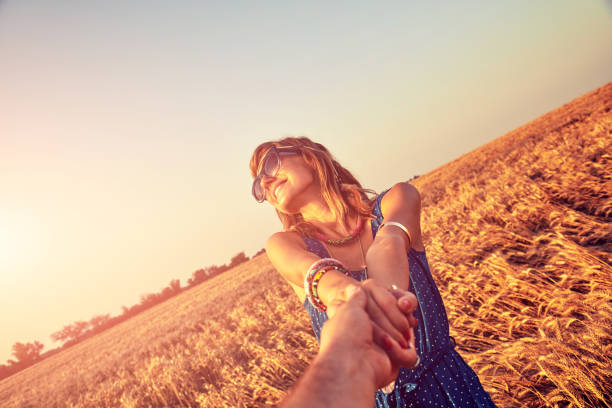 istock Young couple enjoying in a wheat field. 1152388142