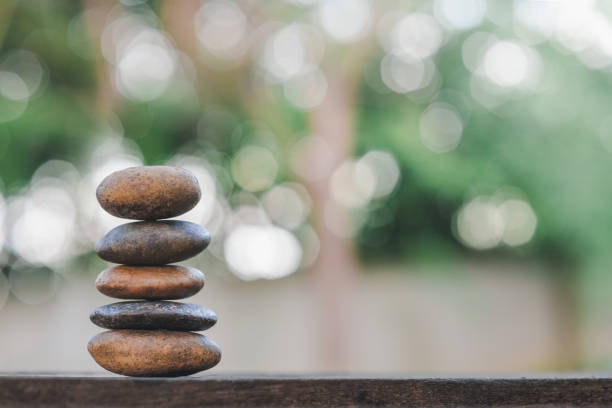 istock Balance stone with spa on bokeh nature background 1152389024