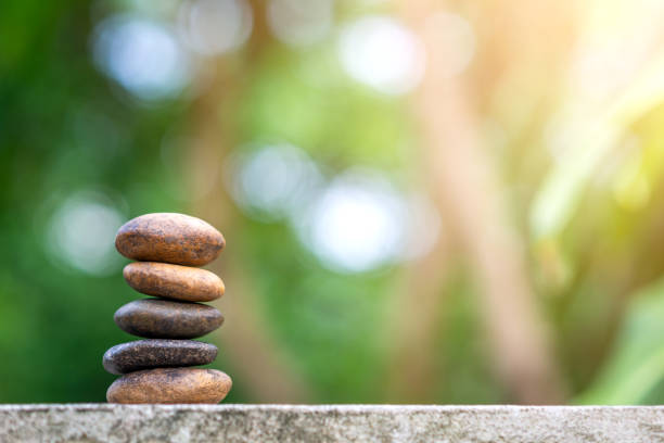 istock Balance stone with spa on bokeh nature background 1152389027