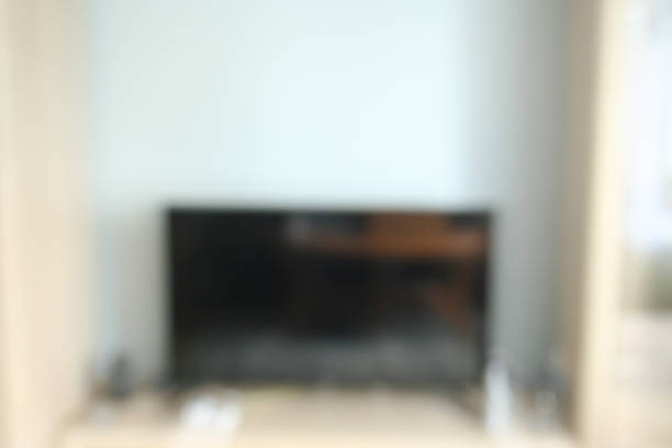 istock blur image background, interior decoration in white home with television 1152390959