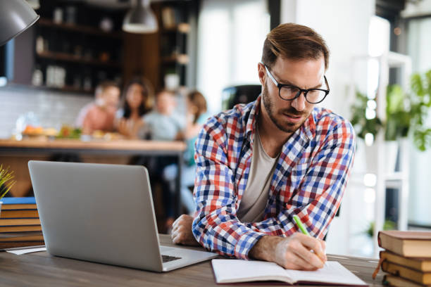 istock Man looking at his monthly bills at home 1152395530