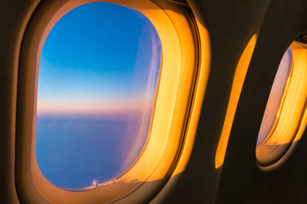 Sunlight beautifully lying on the portholes of the aircraft at sunset