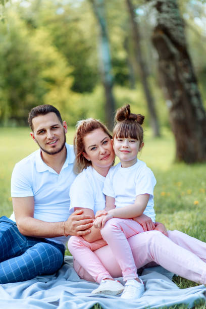 istock Happy parents playing with their daughter. 1152398785