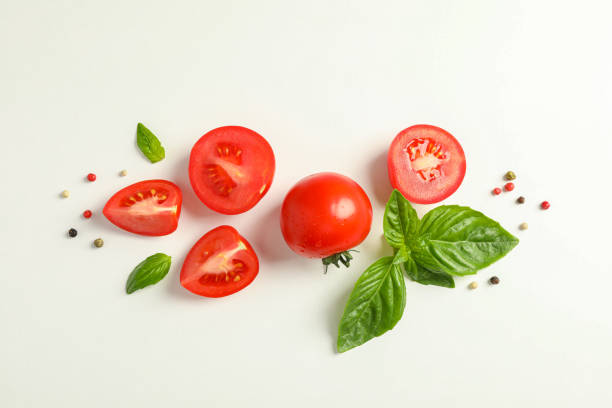 istock Flat lay composition with fresh cherry tomatoes, pepper and basil on white background, space for text. Ripe vegetables 1152399613