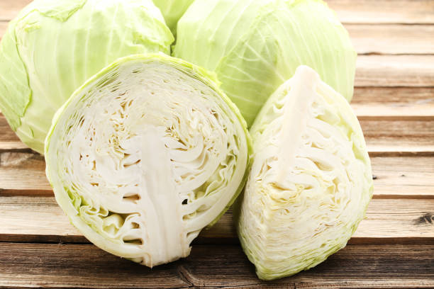 istock Ripe cabbage on brown wooden table 1152401200