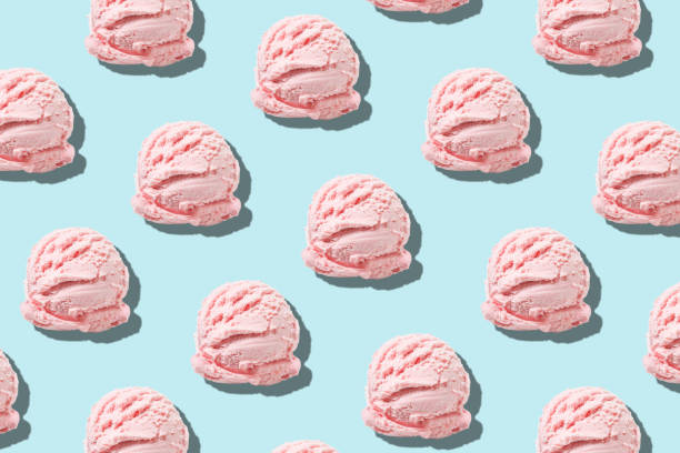 istock Creative summer pattern made with pink ice cream scoops on bright background. Minimal summer concept. 1152402042