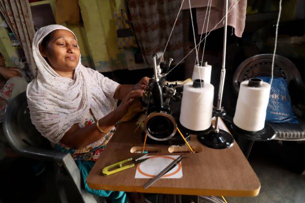 istock Rural women sewing clothes using machine 1152403472