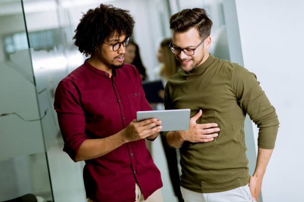 istock Multiethnic business partners using a digital tablet in the office 1152403522