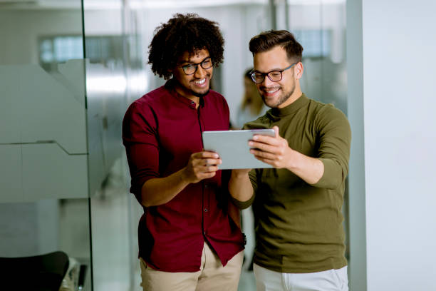istock Multiethnic business partners using a digital tablet in the office 1152403523