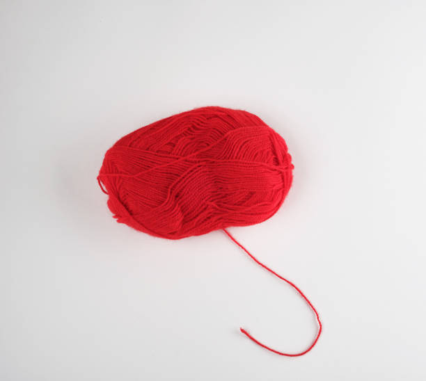 istock big skein of red wool on a white background 1152405640