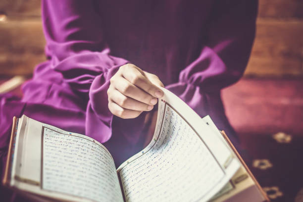 istock Praying young Muslim woman 1152406812
