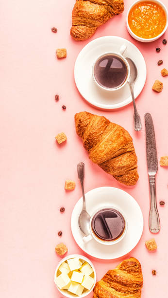 istock Coffee and croissants on pastel background 1152410908