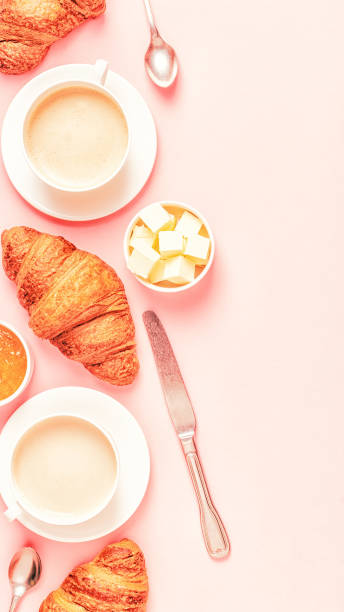 istock Coffee and croissants on pastel background 1152410920