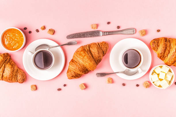 istock Coffee and croissants on pastel background 1152410962