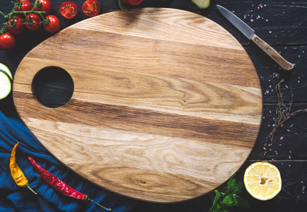 istock Cooking background with cutting board and vegetables 1152412764