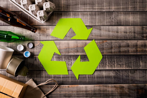 istock Top view of Different garbage materials with recycling symbol on table background. Recycle, World Environment Day and Eco concept 1152412924