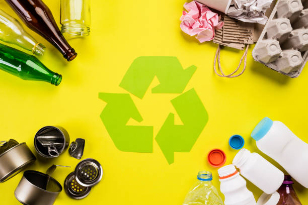istock Top view of Different garbage materials with recycling symbol on table background. Recycle, World Environment Day and Eco concept 1152413064