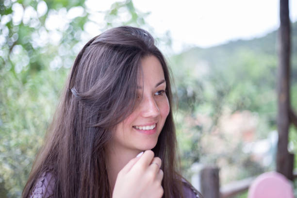 Happy teenager girl, closeup portrait at the park