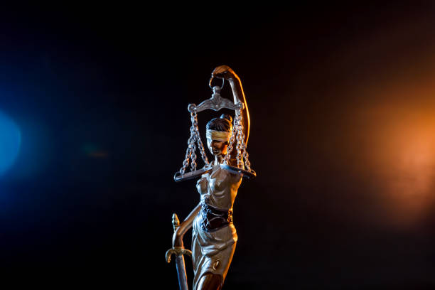 istock Statue goddess of justice on dark background 1152415605