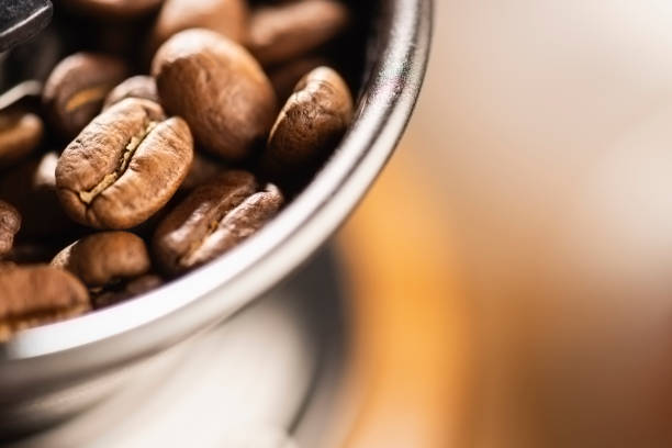 istock Macro image of Coffee beans in a manual coffee-grinding machine 1152416766