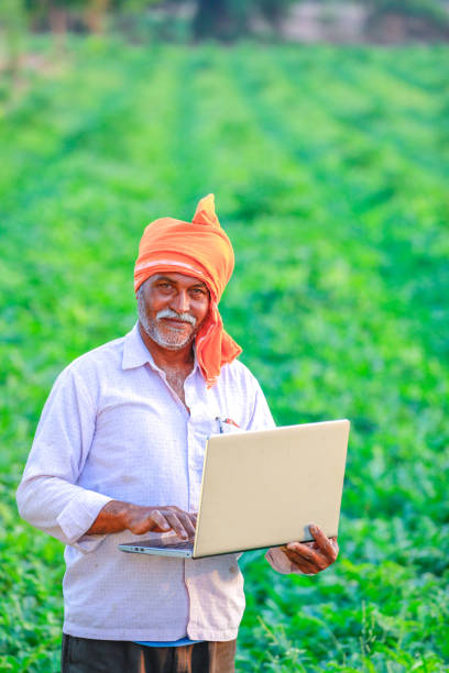 istock Indian rural farmer using laptop 1152417315